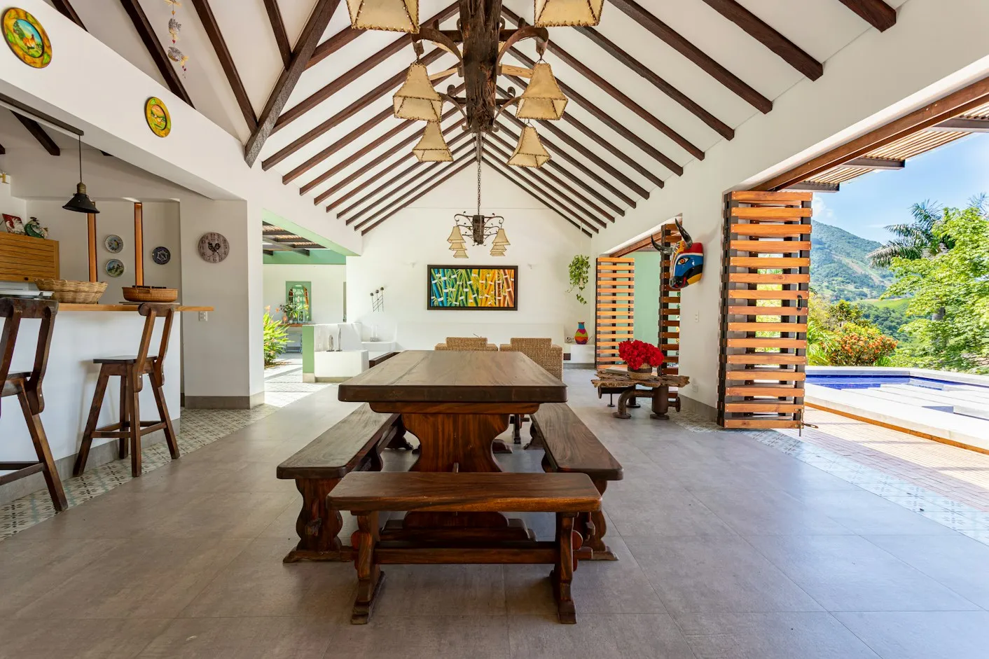 Open-plan living and dining room under a timber roof
